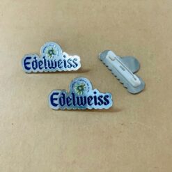 Huy hiệu kim loại hình chiếc răng cưa